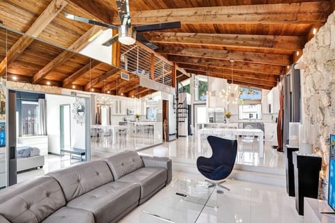 View of the entire living room, dining, kitchen, with preview of loft space