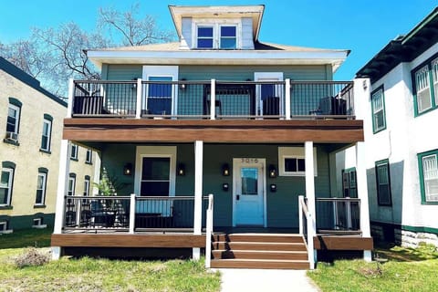 The unit is the lower level of this duplex. The front porch has a seating area. The street in front of the home is popular with bikers so it's a great place to relax and enjoy people watching. 