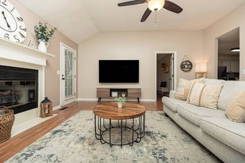 Living room w/ 75 in Smart TV [includes streaming capabilities]