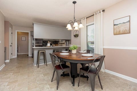 Dining area [seats 4 at table, 3 at bar]