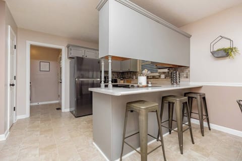 Dining area [seats 4 at table, 3 at bar]