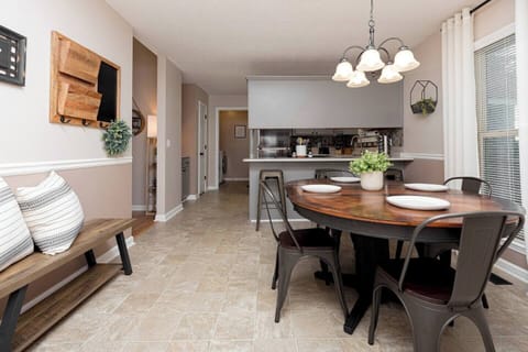 Dining area [seats 4 at table, 3 at bar]