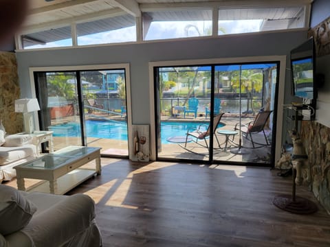 Living room open to pool 