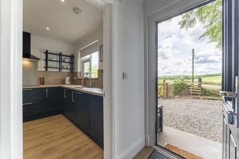View from hallway to kitchen and driveway