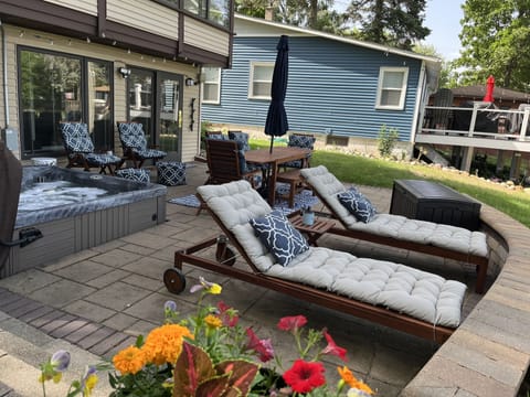 Patio area with hot tub and new furniture (chairs all recline for lounging)