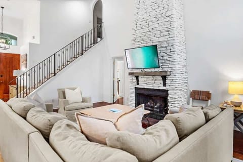 Open Floor Plan with 18ft Chimney and Wrought Iron Banister