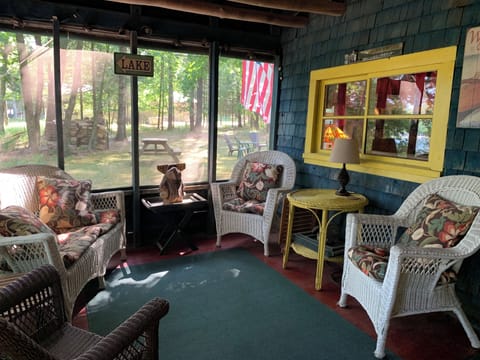 Enjoy your morning coffee on the screened-in porch overlooking the lake
