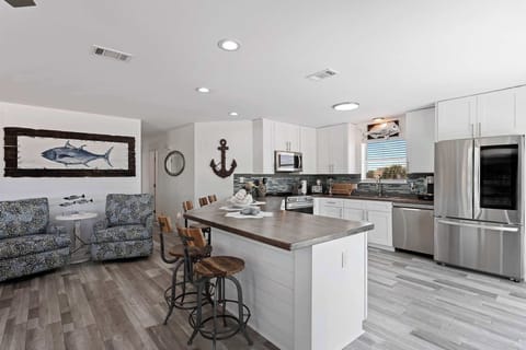 Kitchen & dining space w/ bar seating and an easy, social layout