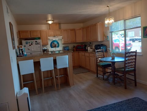 Kitchen, breakfast bar, & dining area