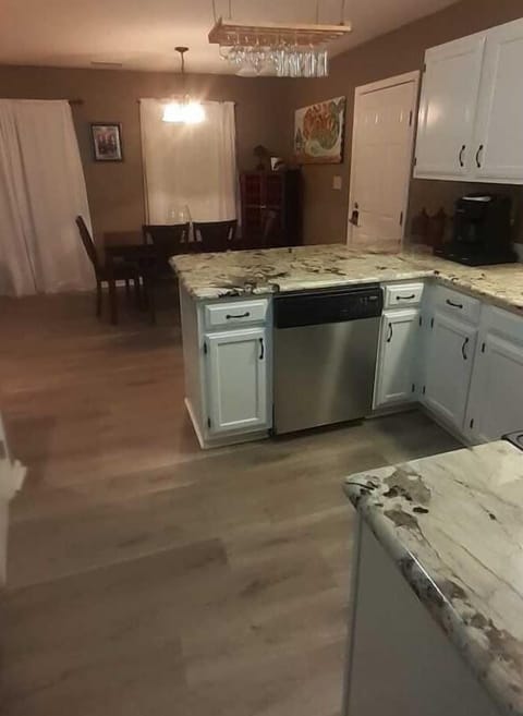 1St Floor Kitchen & Dining Room.  Granite  Counter has 2 Bar Stools.
