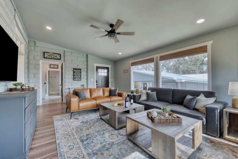Living room with view to the Laundry room and rear entry door