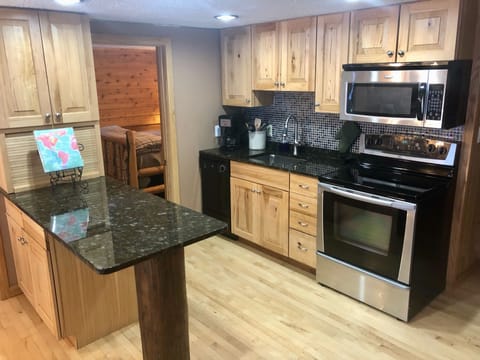 Kitchen with all dinnerware, cookware, and utensils required!