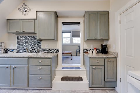Kitchen features hardwood cabinets, space for meal preparation.