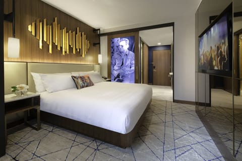 Relax in a spacious king room with bold art accents.