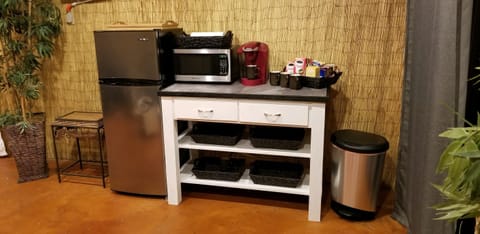 apartment size refrigerator with freezer on top, microwave, toaster, Keurig 