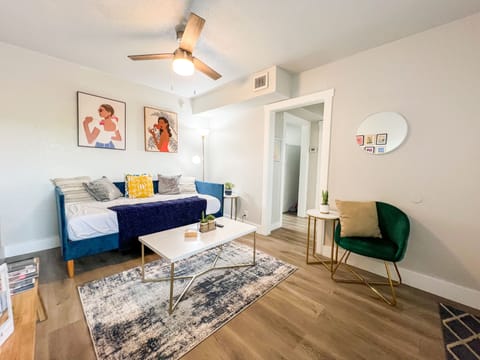Step into our welcoming living room and immerse yourself in a vibrant and colorful atmosphere that exudes energy and charm