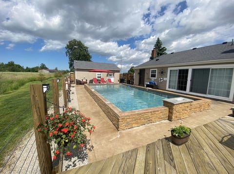 The Pool and "Dry Dock".  Your in ground pool, tanning area + Patio and Grill !