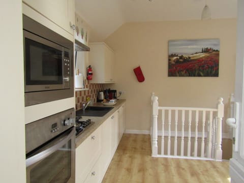 Well equipped upstairs kitchen/lounge area . Fridge,freezer,microwave,oven,hob.