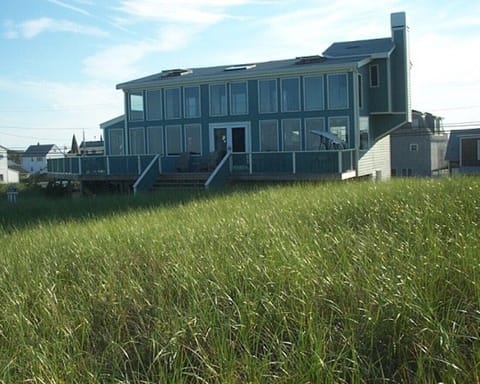 House from the beach, back is 2 levels of all windows.