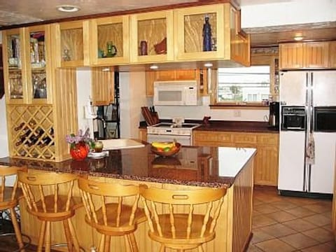 Galley kitchen with views in all directions & open to LR/DR/office