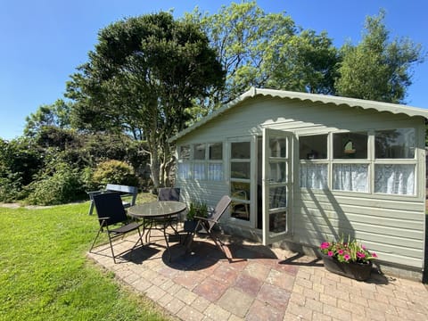 Summer house in walled garden.