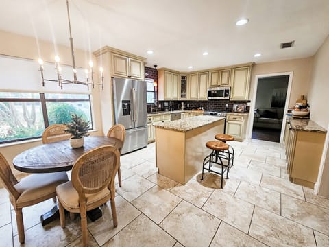 Large well appointed kitchen with breakfast table. 