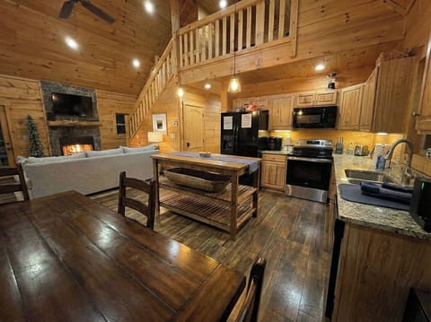 Living room, Kitchen and Dining table in an open-plan space.