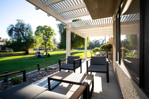 Seating and table outside the condo to relax and enjoy your vacation