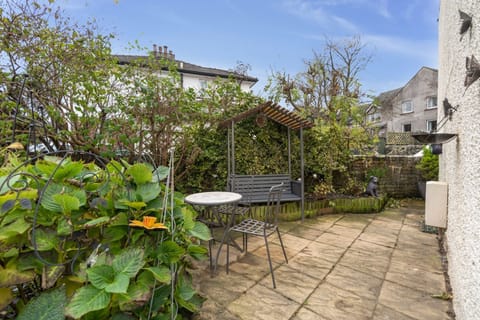 You can relax and enjoy the warmer days in this lovely enclosed garden