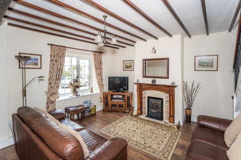 Millside Cottage has a lovely cosy lounge area with living flame gas fire