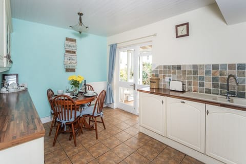 The kitchen features built in appliances, including oven, 5 ringed ceramic touch control hob, microwave, washer dryer, fridge and freezer, dishwasher and Nespresso Magimix coffee machine