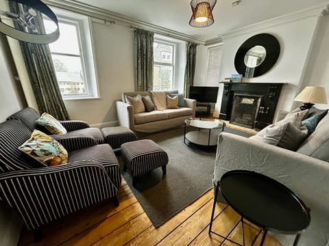 With NEW sofas, unwind in the spacious living room.