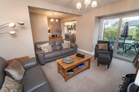 Plenty of space to relax in the living room, which comprises 2x 3 seater sofas and an easy chair