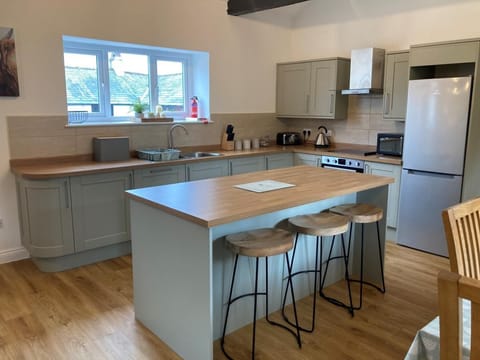 The modern kitchen area is fully equipped with everything that you need to cook during your self-catering holiday