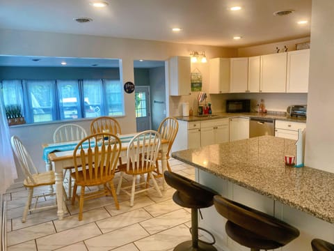 Updated kitchen with dining room table and 3 stool bar
