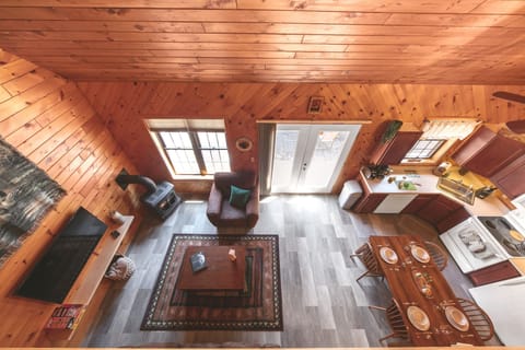 Overlook the main living areas (living room, kitchen/dining) from the loft