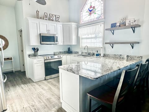 NEW kitchen remodel with granite counters! Well-stocked kitchen with 4 barstools