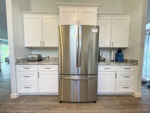 Custom Kitchen Complete with Granite Countertops and Stainless Steel Appliances