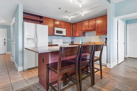 Fully Stocked Kitchen with Lake Views and Island Bar Seating