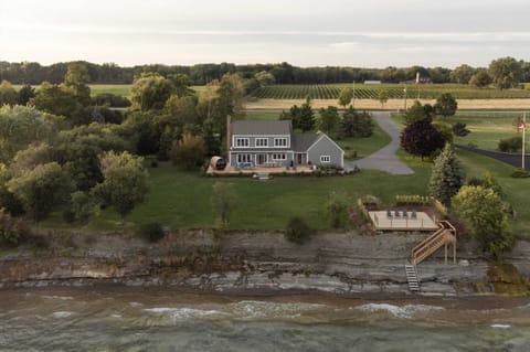 Limestone shelf swimming in the front and vineyards in the back. The Hull House checks all the Prince Edward County boxes.