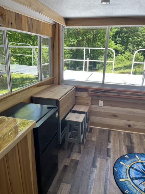 Mini fridge and foldable kitchen table with stools