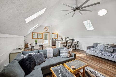Great room with sectional and day bed.  Coffee tables made by our Dad