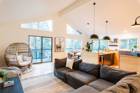 Check out the amazing treetop views from the top floor. With the large windows, you will get plenty of natural light in this cozy family room and plenty of mountain views!