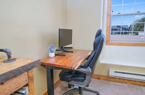 The sit-stand desk is perfect for work-from-home travelers!