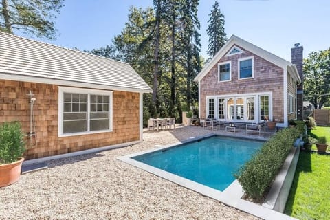 Home and guest home next to the pool and outdoor seating and lounging