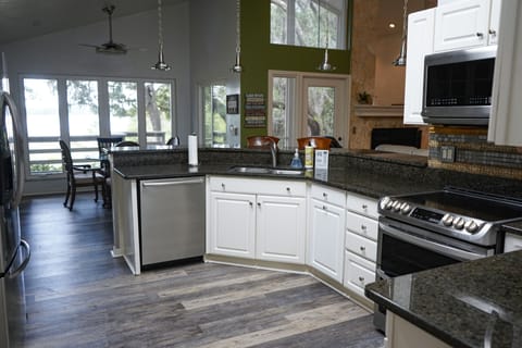 Open, light and bright. Enjoy lake views as you prepare meals