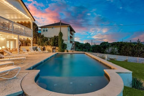 Majestic pool is big enough to host your large gathering for your family reunion or brides maids group or bachelor party.  Hot tub and Newly built Pool Room with large screen TV for watching plenty of sports.  View is from the separate fire pit area