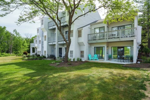 A peaceful, tree-lined setting with open green space right outside your door — your own quiet corner of northern Michigan.