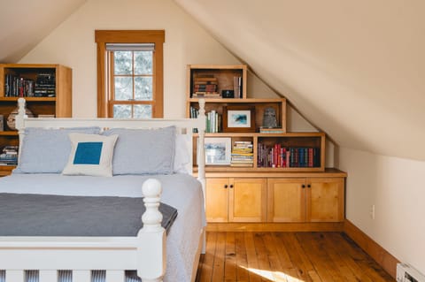 The upstairs bedroom, with bookshelves we built ourselves.