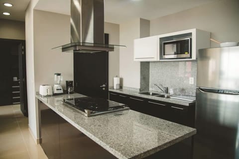 Feel free to indulge in this well-equipped kitchen, whether it's for brewing a cup of coffee or creating delightful meals